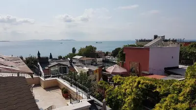 a view of a city with the ocean in the background at Hotel Peninsula in Istanbul