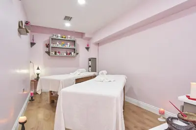 two beds in a room with white table cloths at Sultan Suleyman Palace Hotel & Spa in Istanbul