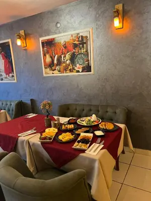 a table with food on it in a restaurant at Sultan Suleyman Palace Hotel & Spa in Istanbul