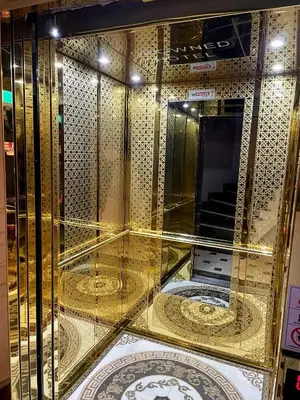 a room with gold walls and a mirror at Crowned Hotel in Istanbul