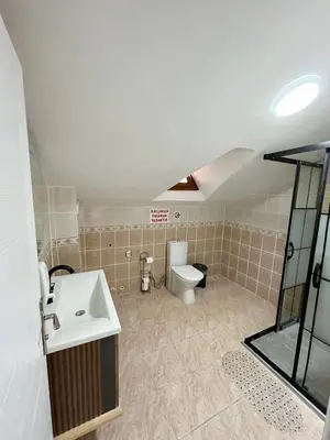 a bathroom with a sink and a toilet at Sapanca Albar Konaklama in Sapanca