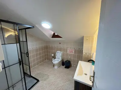 a bathroom with a toilet and a sink at Sapanca Albar Konaklama in Sapanca