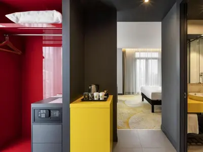 a room with a yellow counter and a bed at ibis Styles Istanbul Merter in Istanbul