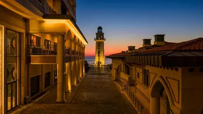 a lighthouse in the middle of a street with buildings at Birun Ada Hotel in Istanbul