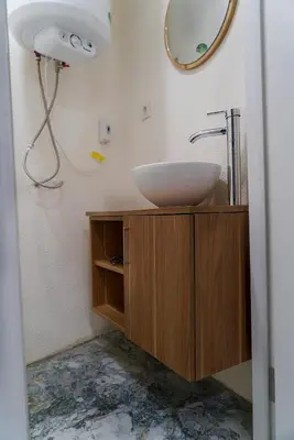 a bathroom with a sink and a mirror at The Havana Residence in Istanbul