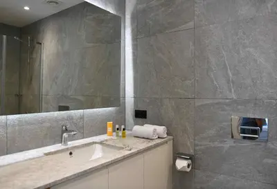 a bathroom with a sink and a mirror at G Tower Furnished Apartment Rentals in Istanbul