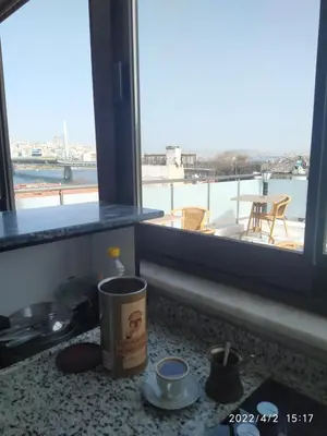 a kitchen counter with a view of a large window at BoNaMi Hotel in Istanbul