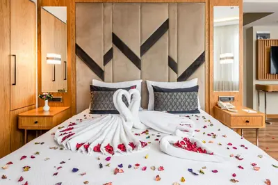 a bedroom with a large bed with swans on it at Endican Sultanahmet Hotel in Istanbul