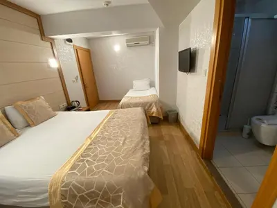 a small room with a bed and a bathroom at Timeks Hotel Sultanahmet in Istanbul