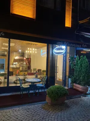 a restaurant with a table and chairs in a window at Victorious Hotel in Istanbul