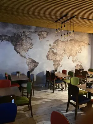 a restaurant with a map of the world on the wall at Victorious Hotel in Istanbul