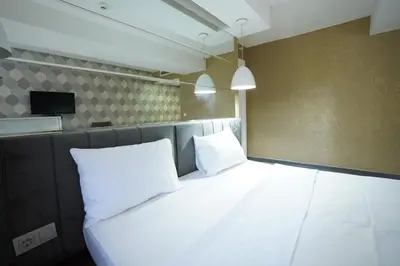 a large white bed with two pillows in a room at Time Hotel Mecidiyekoy in Istanbul