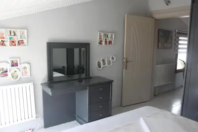 a bathroom with a sink and a mirror on the wall at yelken apart hotel in Tekirdag