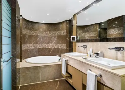 a bathroom with a tub and a sink at Radisson Blu Hotel, Istanbul Sisli in Istanbul