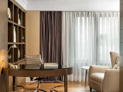 a living room with a desk and a chair at Radisson Blu Hotel, Istanbul Sisli in Istanbul