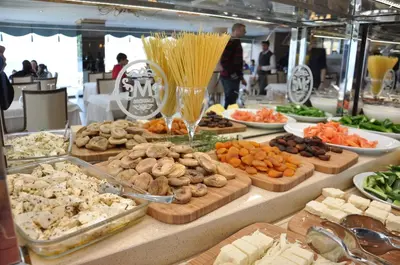 a buffet filled with different types of food on a table at Motali Life Hotel in Masukiye