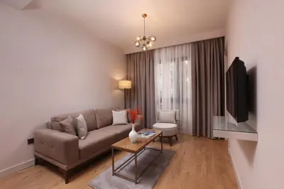 a living room with a couch and a table at The Pearl Suites in Istanbul