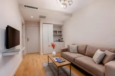 a living room with a couch and a table at The Pearl Suites in Istanbul