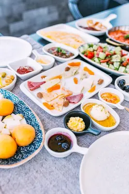 a table with plates of food and bowls of food at RW BOUTIQUE HOTEL in Istanbul