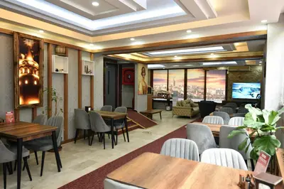 a restaurant with tables and chairs and a view at Istanbul Galata Port Modern Suite & Apartments Taksim in Istanbul