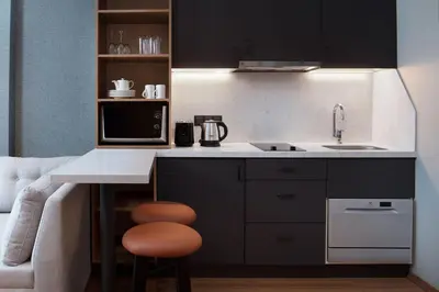 a kitchen with a counter and a sink and a microwave at Residence Inn by Marriott Istanbul Atasehir in Istanbul