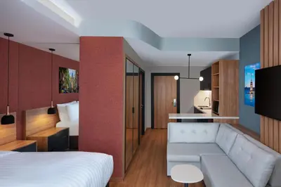 a hotel room with a bed and a couch at Residence Inn by Marriott Istanbul Atasehir in Istanbul