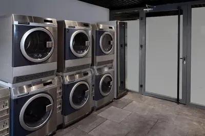 a row of washing machines in a laundry room at Residence Inn by Marriott Istanbul Atasehir in Istanbul