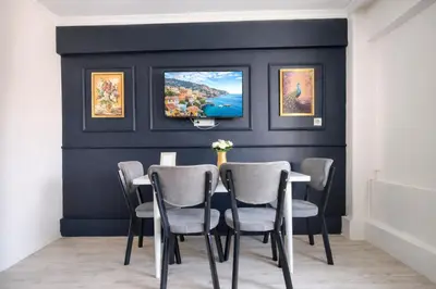 a dining room with a table and chairs at Alpacino Apart Hotel in Istanbul