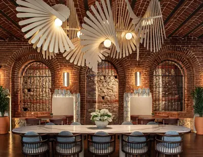 a large room with chairs and large chandeliers at Ecole St. Pierre Hotel in Istanbul