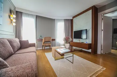 a living room with a couch and a table at Valente Suites&Hotel in Istanbul