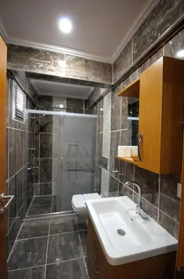 a bathroom with a sink and a shower at Marida Residence - Istanbul Taksim in Istanbul