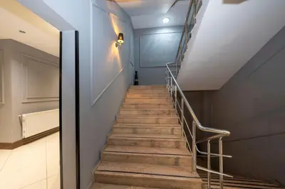 a staircase in a building with a metal railing at Comfort Suites Hotel in Istanbul