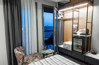 a room with a bed and a window with a balcony at Dosso Dossi Hotels Yenikapı in Istanbul