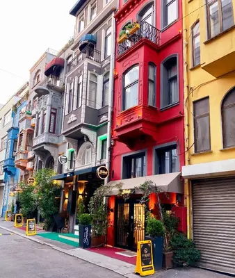 a row of colorful buildings on a city street at HOTEL BRONTE in Istanbul