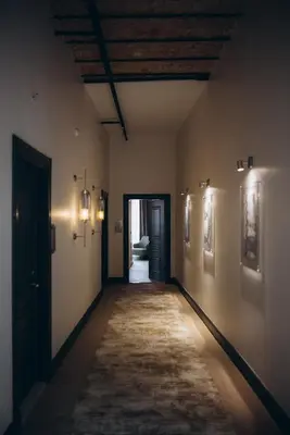 an empty hallway in a building with lights on the walls at Mest Hotel Istanbul Sirkeci in Istanbul