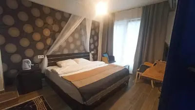 a hotel room with a bed and a window at Gölyaka Hotel in Bursa