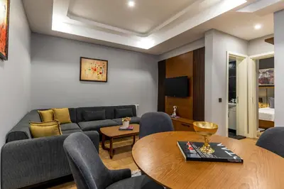 a living room with a couch and a table at SALA SUITES in Istanbul