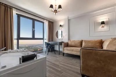 a living room with a tub and a couch at LAGUN CASTLE HOTEL&SPA in Yalova