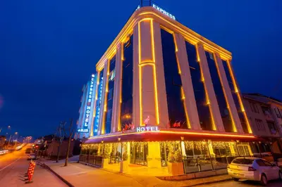 a lit up building with a hotel at night at Express Plus Hotel in Istanbul