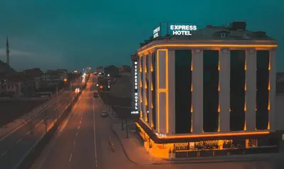 a building on the side of a road at night at Express Plus Hotel in Istanbul