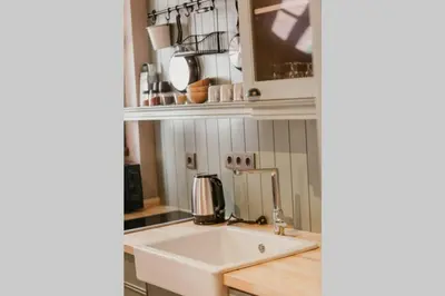 a kitchen with a white sink and a counter at Galadoo Suites 2nd Floor in Istanbul