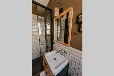 a bathroom with a sink and a mirror at Galadoo Suites 2nd Floor in Istanbul