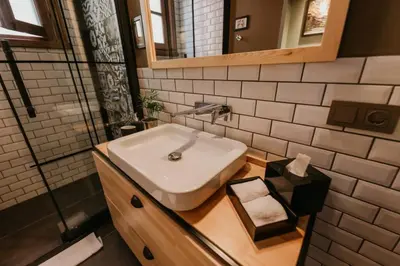 a bathroom with a white sink and a mirror at Galadoo Suites 3rd Floor in Istanbul