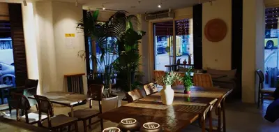a dining room with tables and chairs and plants at Hotel Le Mirage in Istanbul