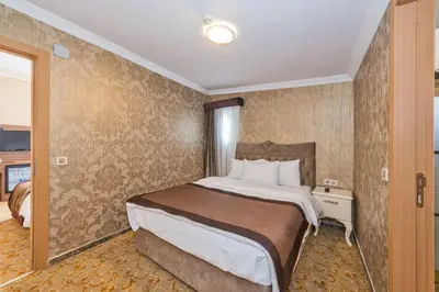 a bedroom with a large bed in a room at Montagna Hera Hotel Taksim in Istanbul