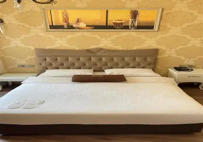 a bedroom with a large bed with a white bedspread at Montagna Hera Hotel Taksim in Istanbul