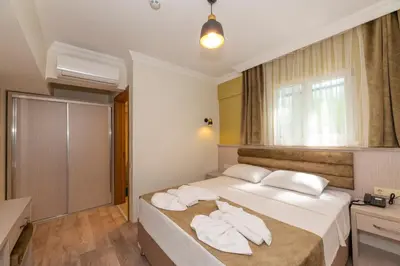 a hotel room with a bed with towels on it at Bazaar Hotels Old City in Istanbul