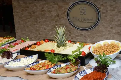 a table topped with bowls of different types of food at MİLLS HOTEL in Tekirdag