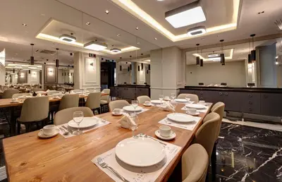a dining room with a long table and chairs at Dora Pera Hotel in Istanbul