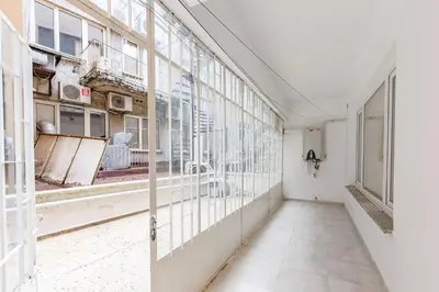 an empty room with windows and a corridor at Altiyol Boga, Center of Kadıköy in Istanbul